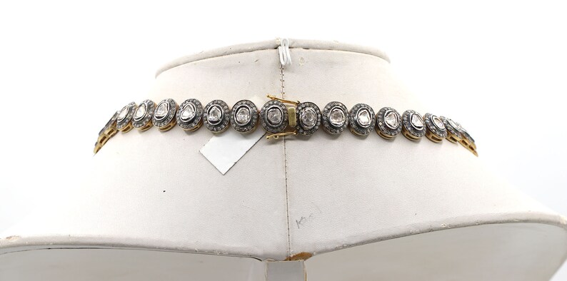 Necklace worn by model, showing drape and fit for bridal or formal occasions
