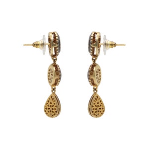 Close-up of individual Polki diamonds, showcasing natural sparkle and handcrafted setting