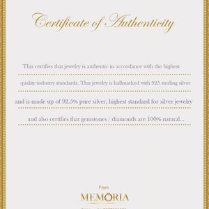 May include: Certificate of Authenticity for jewellery, stating it is made with 925 sterling silver and 92.5% pure silver. It also certifies that gemstones and diamonds are 100% natural. The certificate is from MEMORIA, with contact information for phone and email.