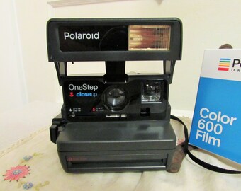 Polaroid One Step camera with film