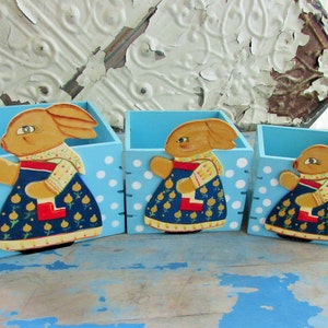 three wood bunny nesting boxes