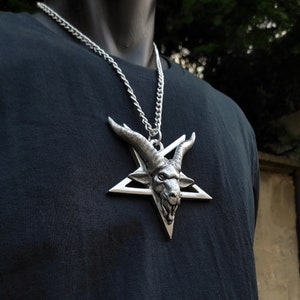 Large satanic goat head pentagram necklace , huge baphomet inverted pentacle art , massive obscure underground goth culture ornament present