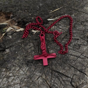 Big bloody inverted crucifix necklace , satanic cross drenched in blood , massive black metal jewelry , brutal ritualistic dark artefact