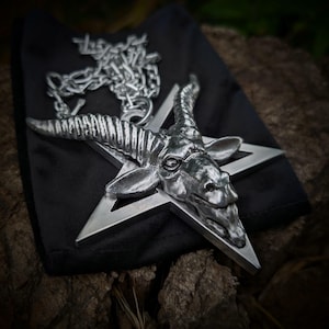 Large satanic goat head pentagram necklace , huge baphomet inverted pentacle art , massive obscure underground goth culture ornament present