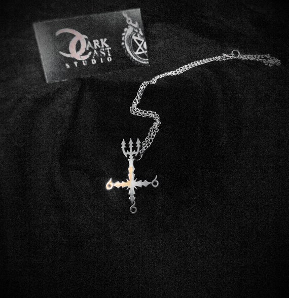 Vicar of dibley cross 2024 necklace upside down