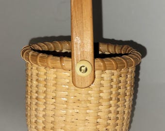 Nantucket Style Small Woven Basket with Wooden Bottom and Cream Colored Buttons on Folding Handle