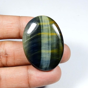 Gema de ojo de tigre azul. Ojo de tigre azul amarillo natural. Increíble cabujón de ojo de tigre azul. Ojo de tigre ovalado para joyería. 65 quilates. KB-9008