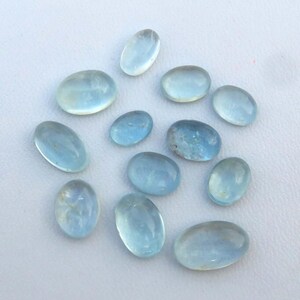 Hemelsblauw aquamarijn. Natuurlijke aquamarijn edelsteen. Awesome ~ Aquamarijn cabochon groothandel lot 12 stuks ovale vorm voor sieraden. 32 kt. KB-4081