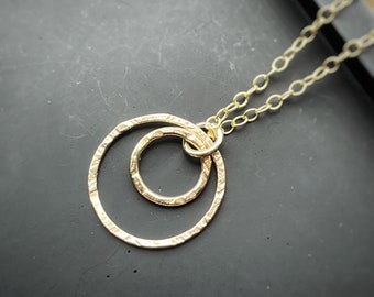 Solid gold interlocking circle pendant, a handmade hammered textured 9ct solid gold hoop, round modern gold chain necklace