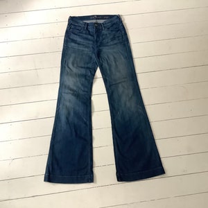 Blue low-rise Seven7 flare jeans with a subtle flare