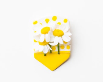 Ceramic white and yellow fresh flower boutonniere pin.