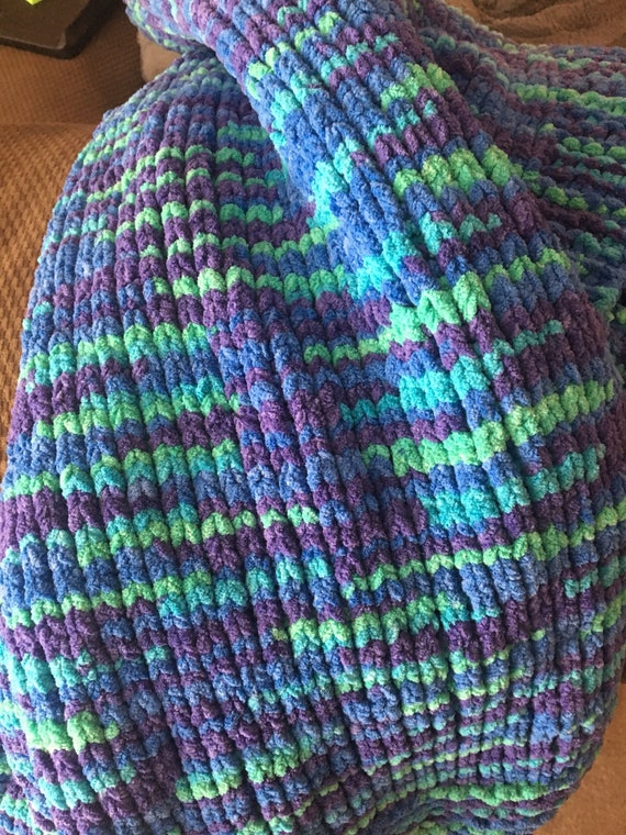 Northern Lights Blanket Hand Knit With Bernat Blanket Yarn Making It Super Soft And Chunky Nice Mix Of Purple Green And Blue Very Warm Northern Lights Blanket Hand Knit With Bernat Blanket Yarn Making It Super Soft And Chunky Nice Mix Of Purple Green And Blue Very Warm