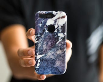 May include: A phone case with a marble pattern in shades of blue, white, and purple.