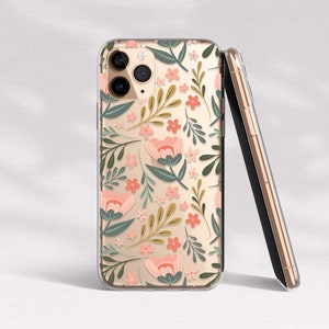 May include: A clear phone case with a floral pattern. The case features pink and green flowers and leaves on a white background. The case is designed for an iPhone.