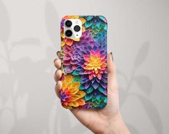 Puede incluir: Una funda de teléfono colorida con un diseño floral. Las flores están hechas de papel y están dispuestas en un patrón circular. Los colores son brillantes y vibrantes, incluyendo rosa, morado, amarillo, verde y azul.