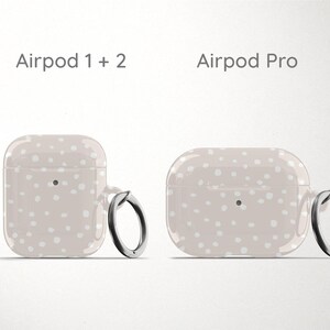 a pair of airpods sitting next to each other