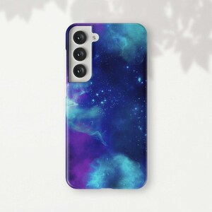 a phone case with a blue and purple galaxy design