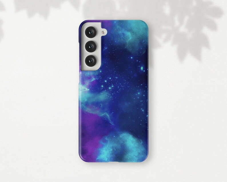 a phone case with a blue and purple galaxy design