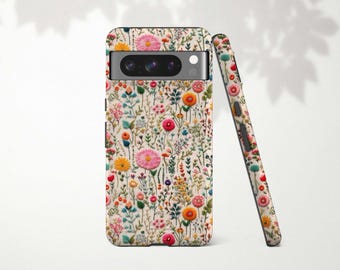 May include: A phone case and matching phone cover featuring a floral pattern with pink, yellow, and orange flowers on a cream background. The case has a camera cutout and a sleek design.