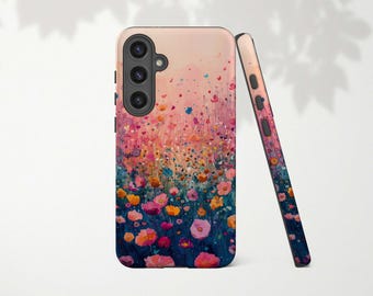 Puede incluir: Una funda para teléfono con un diseño floral colorido. La funda tiene un patrón floral rosa, naranja y amarillo sobre un fondo blanco. La funda tiene un recorte de cámara negro y un lado negro.