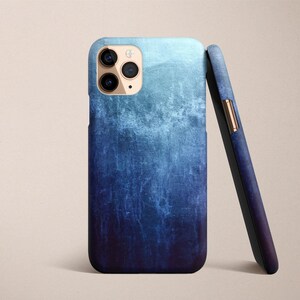 a phone case with a pen on top of it