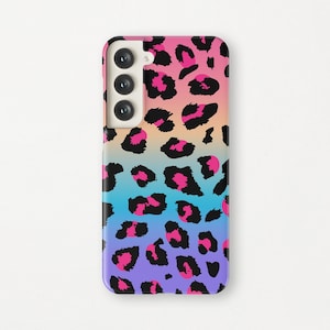 May include: A phone case with a pink, blue, and yellow ombre background and a black leopard print.