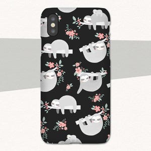 May include: Black phone case with a repeating pattern of gray sloths hanging from branches with pink flowers.