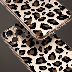 May include: Two clear phone cases with a leopard print design. The case on top has a gold trim. The case on the bottom has a camera cutout.
