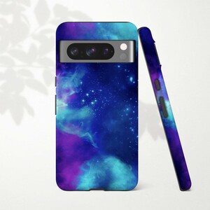 a purple and blue galaxy phone case next to a pen