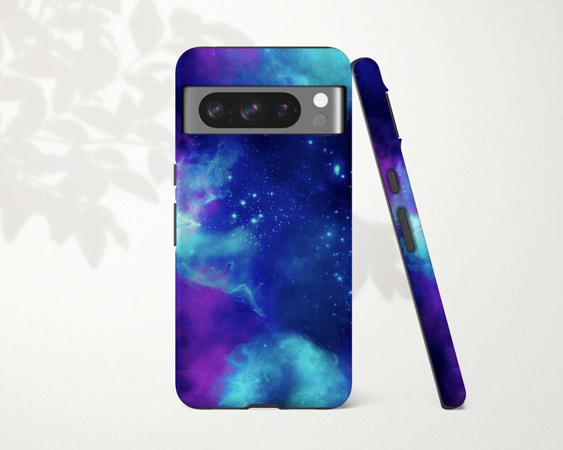 a purple and blue galaxy phone case next to a pen