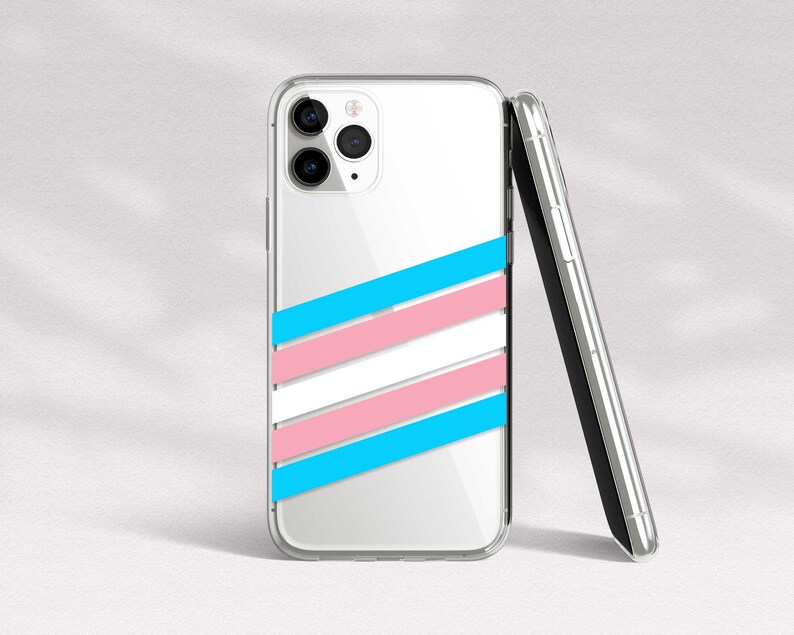 May include: A clear phone case with a white, pink, and blue striped design. The case is designed to fit a smartphone with a triple camera lens.