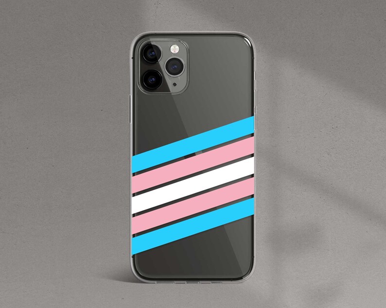 May include: A clear phone case with a diagonal pattern of blue, pink, and white stripes. The case is designed for a phone with a triple camera lens.