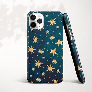 a phone case with gold stars on a blue background