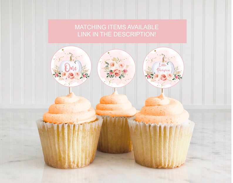 May include: Three cupcake toppers with pink and gold pumpkin designs. The toppers say "One", "Little Pumpkin", and feature a floral design.