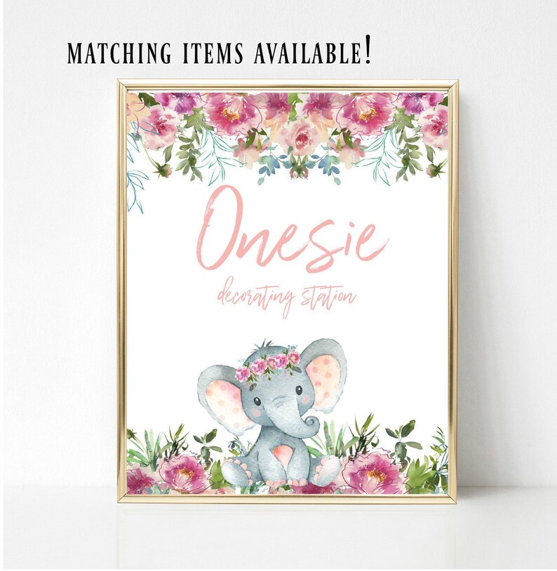 May include: A printable sign with a pink floral border and a gray elephant with a pink floral crown. The sign says "Onesies decorating station".
