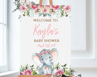May include: Welcome to Kayla's Baby Shower sign with a pink floral border and a cute cartoon elephant wearing a pink flower crown. The sign says "Welcome to Kayla's Baby Shower March 27th, 2019".