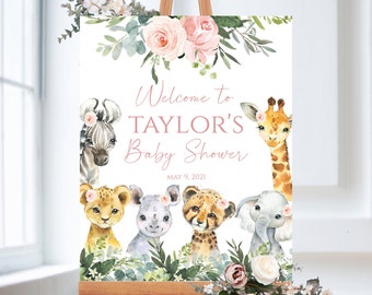 May include: Welcome to Taylor's Baby Shower sign with a pink floral design and a watercolor illustration of a zebra, lion, rhino, cheetah, and elephant. The sign also includes the date May 9, 2021.