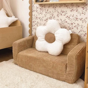 May include: A set of three ceramic mugs with a speckled, matte finish. The mugs are in shades of cream, light gray, and dark gray. Each mug has a simple, minimalist design, perfect for coffee or tea.