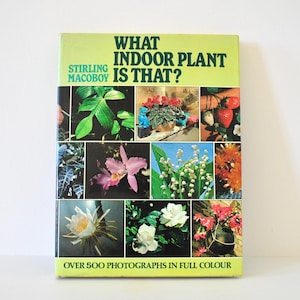 May include: A vintage book titled "What Indoor Plant Is That?" by Stirling Macoboy. The cover features a collage of colorful plant and flower photographs. The book is in full colour and has over 500 photographs.