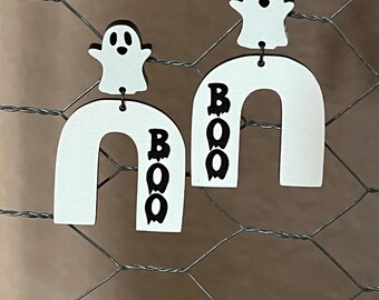 May include: White wooden earrings with a ghost and the word "BOO" on each earring.