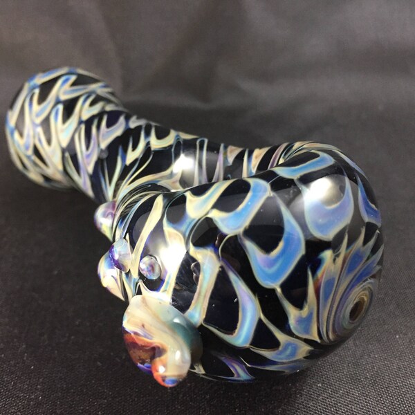 Glass smoking pipe, hand blown, wrap and rake tobacco pipe. Black glass with blue and amber purple.