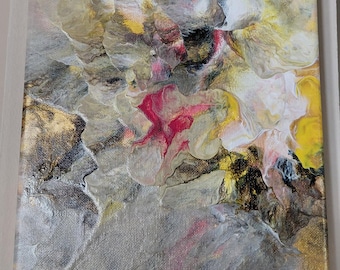 May include: A square canvas painting featuring an abstract fluid acrylic pour design. The composition displays a blend of metallic gold, silver, white, and gray tones, accented by vibrant streaks of magenta and bright yellow throughout the surface.