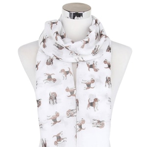 May include: White scarf with a pattern of brown and white beagle dogs.