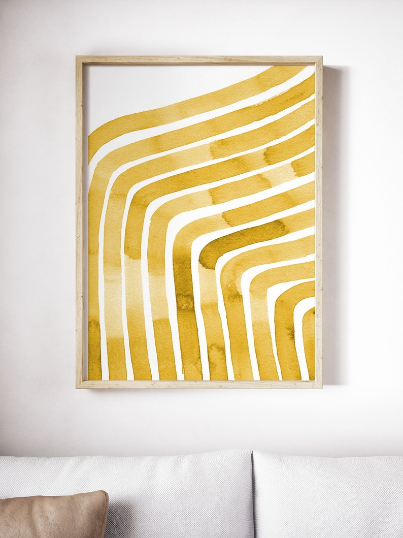 May include: A framed abstract print with a yellow watercolor design of curved lines on a white background.