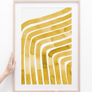 May include: A framed print with a watercolor design of abstract yellow lines on a white background.