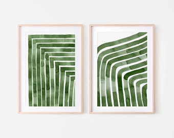 May include: Two framed prints with abstract green watercolor designs. The designs are made up of curved and straight lines.