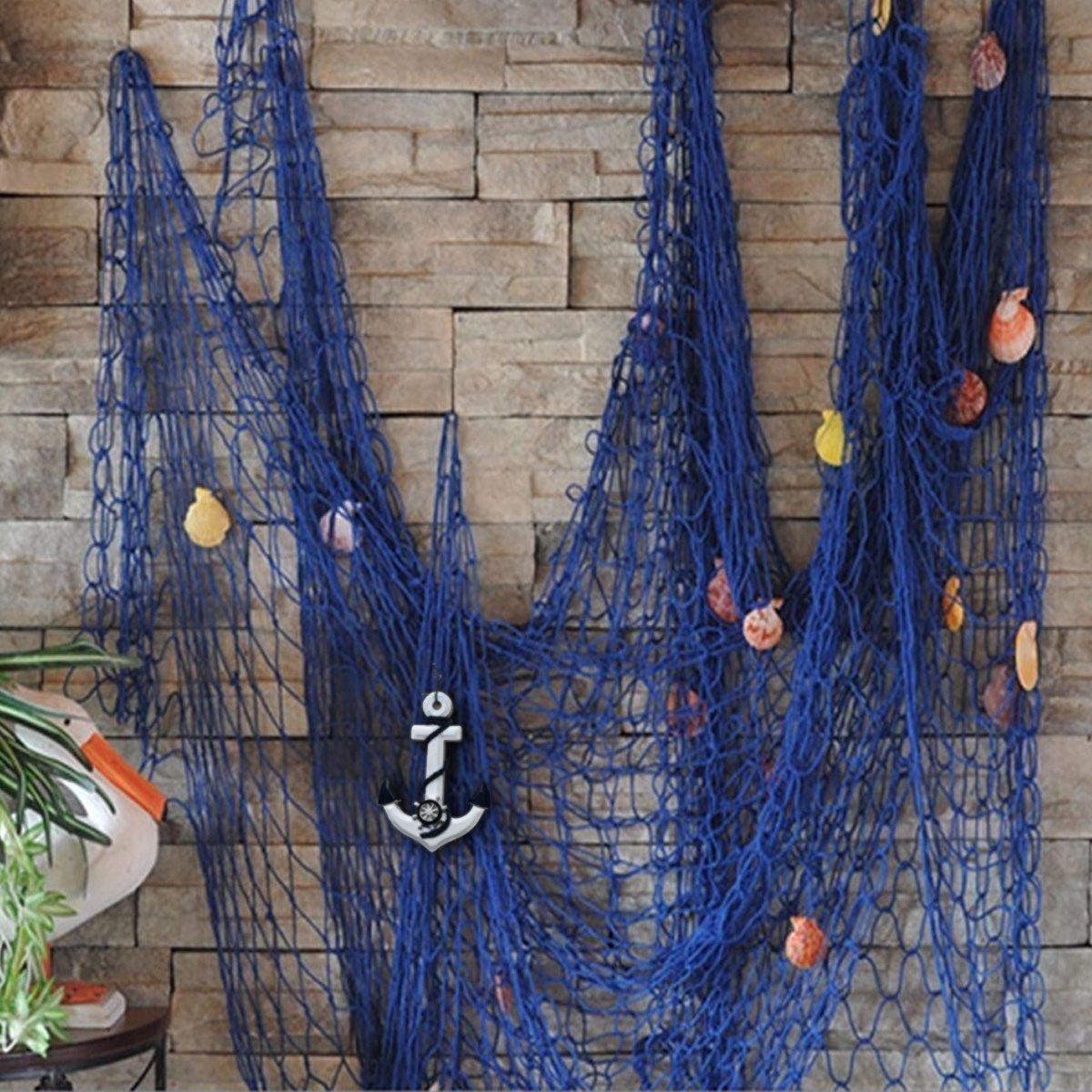 Old fish nets give a nice background to hang fish, starfish