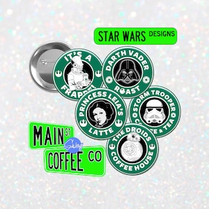 May include: Five round green and white buttons with Star Wars characters and coffee-themed text. The buttons feature Darth Vader, Princess Leia, a Stormtrooper, a droid, and a creature from Star Wars. The text on the buttons reads "Darth Vader Roast", "Princess Leia's Latte", "Stormtrooper Coffee & Tea", "The Droids Coffee House", and "It's a Frappuccino".  The buttons are arranged in a circle around a green sign that reads "Main St Swag Coffee Co."