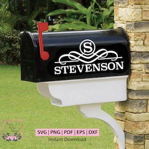 May include: A black mailbox with a white monogram and the name "STEVENSON" in a decorative script font. The mailbox has a white flag and a white base.