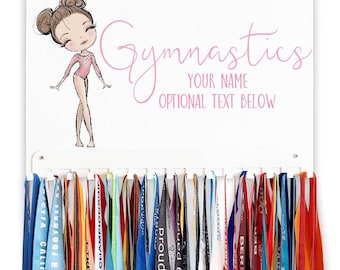 May include: White medal display rack with a pink gymnast illustration and the text "Gymnastics" and "Your Name". The rack has 30 hooks for hanging medals.